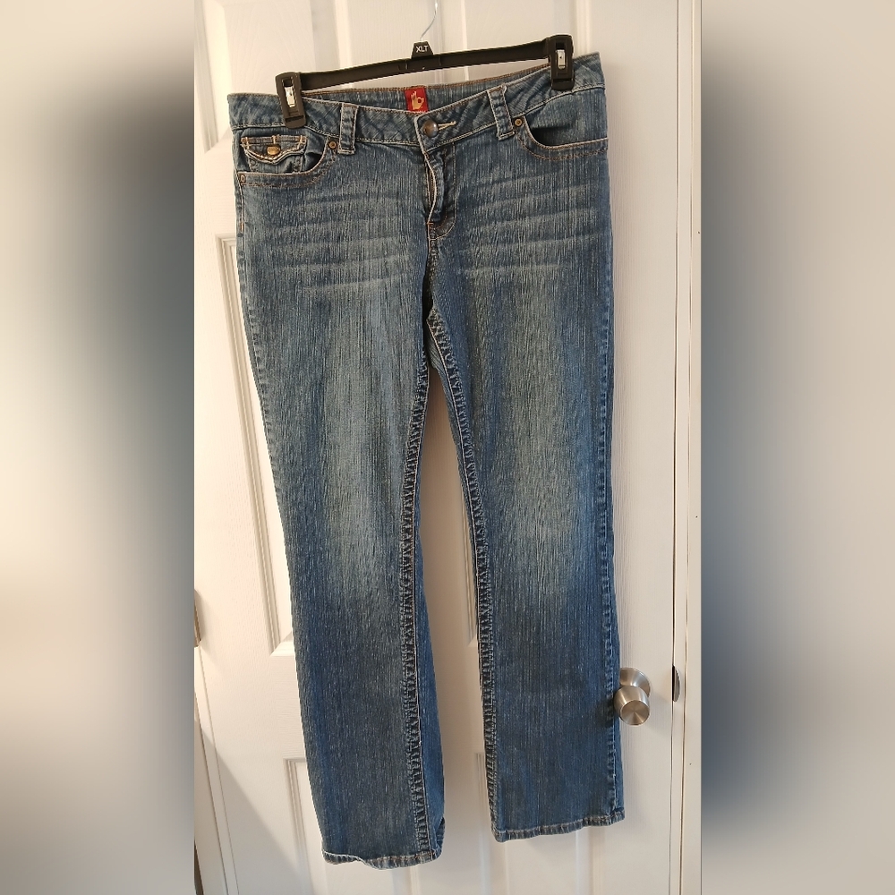 Sasson Jeans – Size 12, Medium Wash Denim with Logo Hardware & Flip‑Tab Pocket